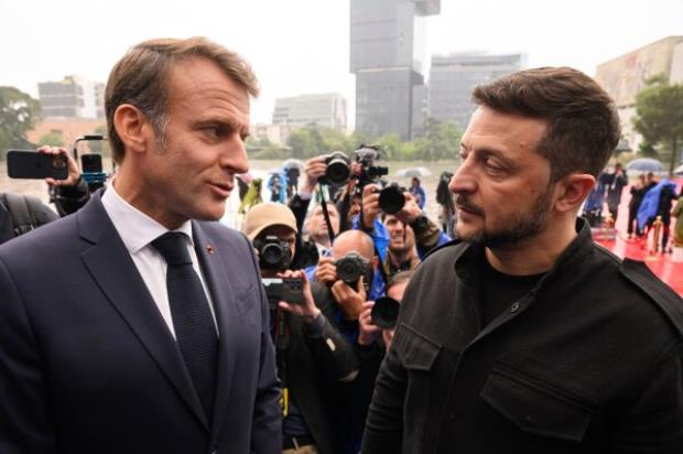 President of France Emmanuel Macron, left, and Ukraine<em></em>'s President Volodymyr Zelenskyy attend a summit wher<em></em>e the leaders of 47 European countries and organizations will discuss security, defense and democratic standards, in Tirana, Albania, Friday, May 16. 2025. (Leon Neal/Pool via AP)